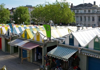 Heavy-duty market stall tarpaulin protecting an outdoor trading stall